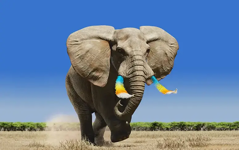 Elephant with feather tusks walking